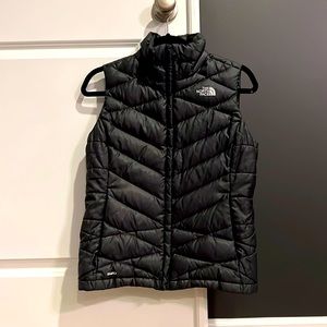 The North Face Black Puffy Vest, size Small. Great condition.